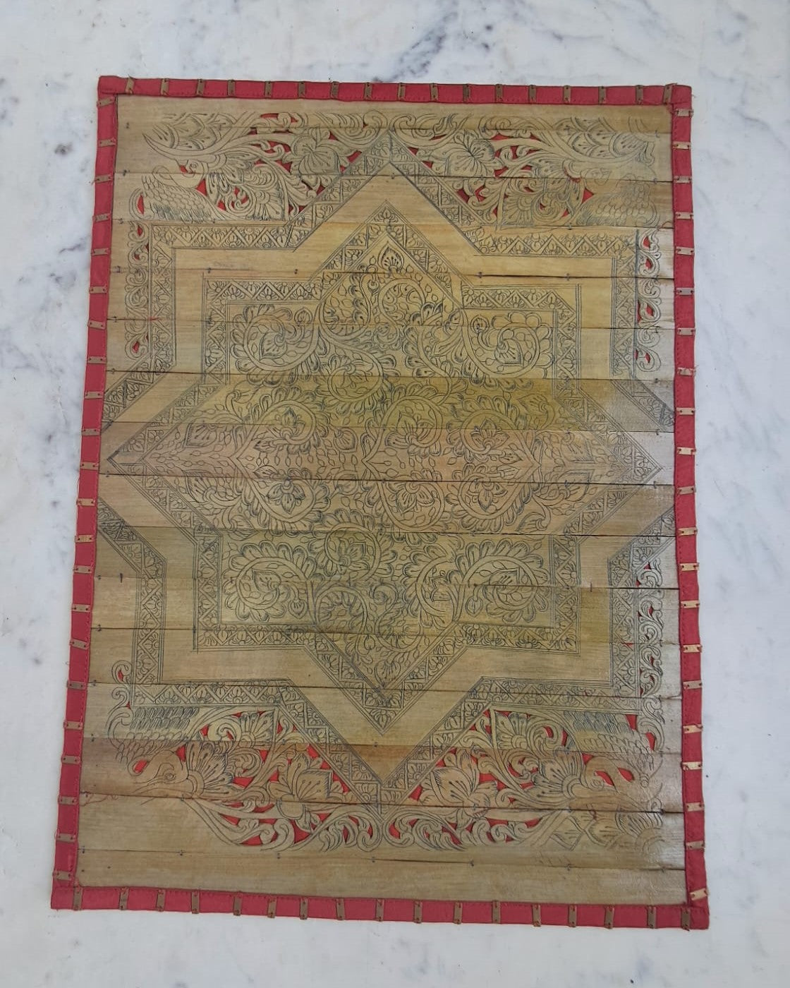 Palm Leaf Placemats with Red Colored Borders with Brass Stripe.
