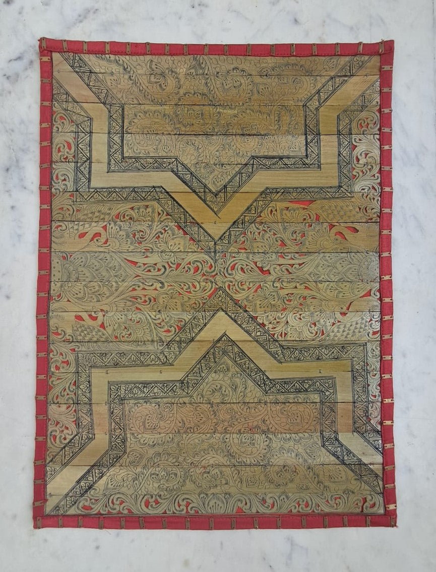 Palm Leaf Placemats with Red Colored Borders with Brass Stripe.