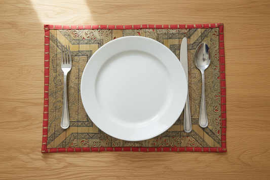 Palm Leaf Placemats with Red Colored Borders with Brass Stripe.