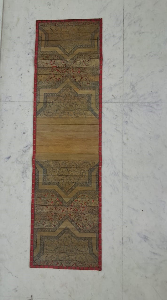 Palm Leaf Runner with Red Colored Borders with Brass Stripe.
