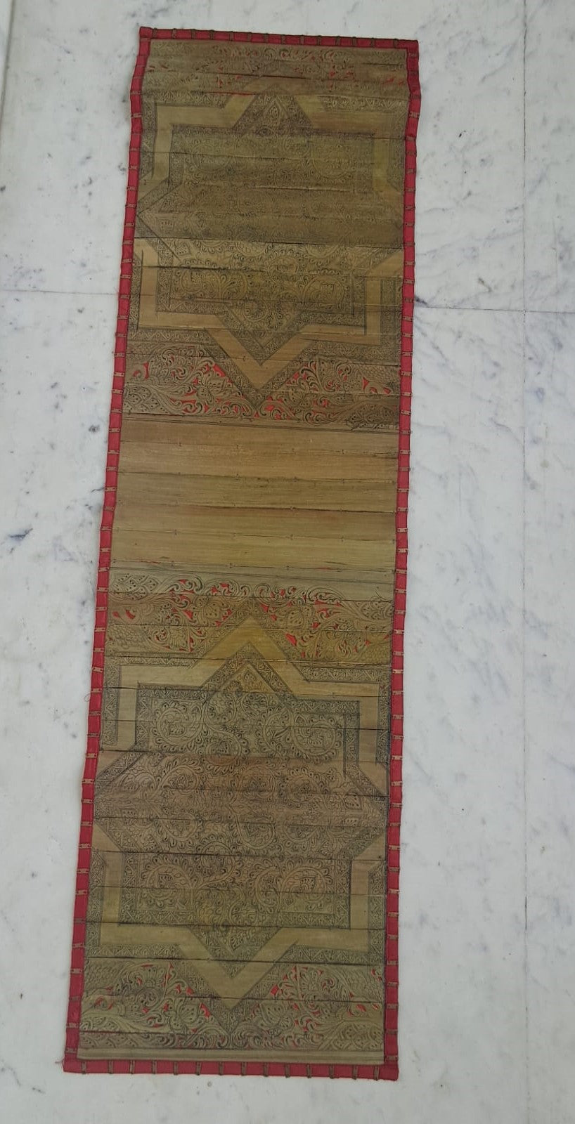 Palm Leaf Runner with Red Colored Borders with Brass Stripe.